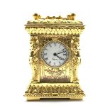 20th century miniature ornate brass carriage time piece, white enamel dial with Roman numeral chapt