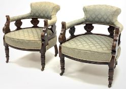 Pair late Victorian carved walnut framed tub shaped salon armchairs, upholstered in patterned green