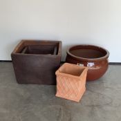 Two graduated rustic cube planters, (W57cm) a glazed terracotta belly pot planter (D56cm) and a sma