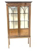 Edwardian mahogany display cabinet, frieze inlaid with boxwood floral swags and stringing, over tra