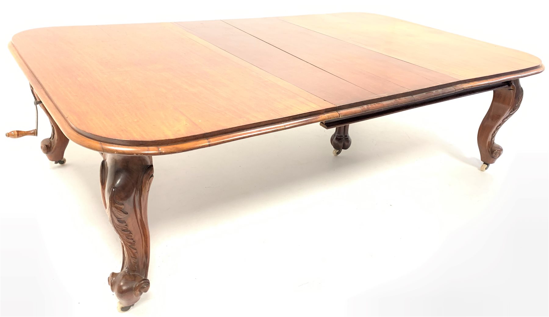 Large Victorian walnut extending dining table, the moulded top with 'D' shaped ends raised on leaf