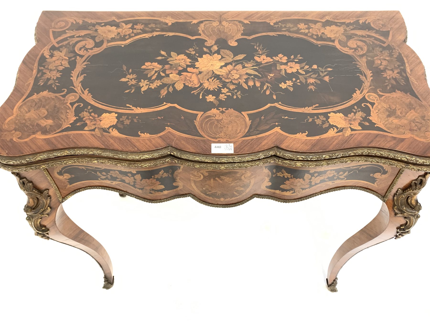 19th century French kingwood marquetry games table, the serpentine floral inlaid fold over revolvin - Image 6 of 10