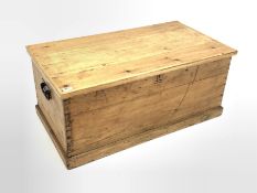 Solid pine blanket box, with metal carry handle to each end and skirted base, W94cm, H41cm, D50cm