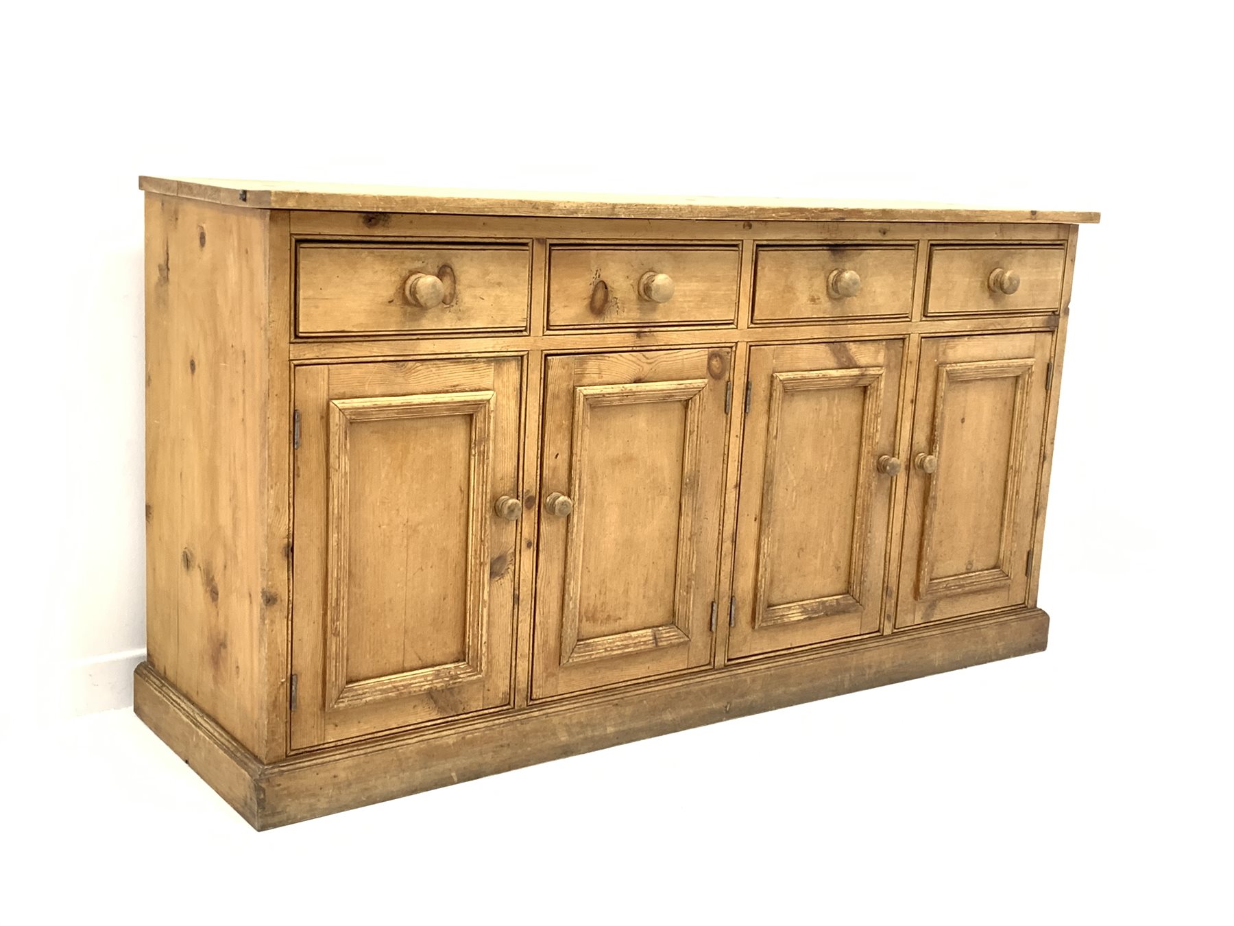 Victorian solid pine dresser base with four drawers over four cupboards, plinth base, W169cm, H89cm
