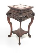 20th century Chinese style stained pine jardiniere stand, with lion mask and leaf carved and pierce