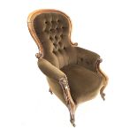 Victorian mahogany framed armchair, upholstered in deep buttoned brown velvet, with scrolled arm te