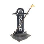 Victorian cast iron stick stand, decorated with mask and scrolled interlaced foliage, (W42cm) and t