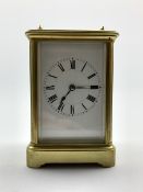 Early 20th century brass four glass carriage time piece, white enamel dial with Roman numeral chapt