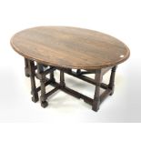 18th century style drop leaf occasional table, the oval top with mahogany cross banding over drawer