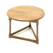 Medium oak circular cricket table, with three turned supports united by stretchers, 66cm x 66cm, H5