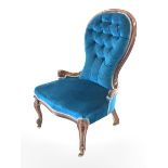 Victorian style stained beech framed spoon back nursing chair upholstered in buttoned blue fabric, H