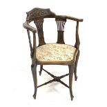Late Victorian corner chair, the raised shaped back relief carved with shell and scrolls, three pier