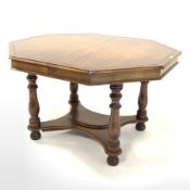 Victorian style walnut octagonal table, with turned supports united by under tier, 114cm x 130cm, H