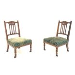 Pair late Victorian walnut bedroom chairs, shaped cresting rail carved with flower heads, upholstere