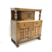 Early 20th century carved oak court cupboard, panelled door to top over two drawers and two panelle