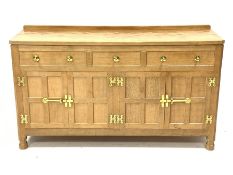 'Eagleman' adzed oak dresser, three drawers above two double cupboards enclosed by four panelled doo