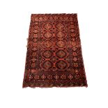 Persian red and blue ground rug decorated with Guls, 148cm x 99cm