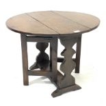 Small late 20th century occasional table, oval drop leaf top, gate action base, shaped end supports