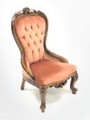 Victorian style beech framed nursing chair, shell and scroll carved cresting rail, upholstered in bu