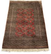 Persian Bokhara design rug, field decorated with Guls, multiple border with geometric motifs, 186cm