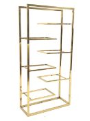 Gilt metal 'Hollywood Regency' etagere, with six cantilevered display shelves, (No glass for shelves