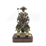 Victorian circa. 1864 brass skeleton clock, twin fusee movement striking on bell, pierced silvered R