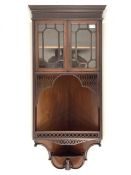 Late Victorian mahogany wall hanging corner cabinet, projecting cornice over blind fret work frieze,