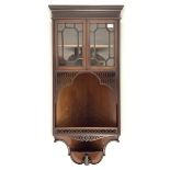 Late Victorian mahogany wall hanging corner cabinet, projecting cornice over blind fret work frieze,