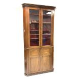 19th century mahogany floor standing corner cupboard, dentil cornice over two glazed doors enclosin