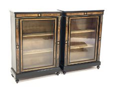 Pair Victorian ebonised and figured walnut pier display cabinet, glazed door enclosing shelves, flor