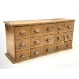 Victorian pine chemist type haberdashery chest fitted with fifteen drawers, each drawer with cup han