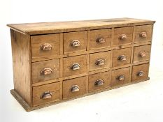 Victorian pine chemist type haberdashery chest fitted with fifteen drawers, each drawer with cup han