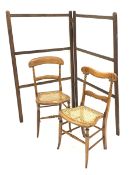 Two Victorian beech framed bedroom chairs with cane seats and a 19th century pine clothes horse