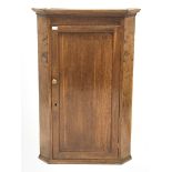 19th century tall oak corner cupboard, single panelled door enclosing three shaped shelves, W82cm, H