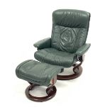 Stressless recliner swivel armchair upholstered in green leather with matching footstool