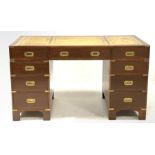20th century Campaign style mahogany twin pedestal desk, the top with inset tooled leather writin
