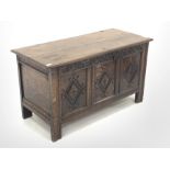 19th century oak coffer, moulded two plank hinged top, guilloche carved frieze above three panels ca