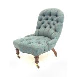 Victorian mahogany framed nursing chair upholstered in buttoned fabric, turned front supports with '