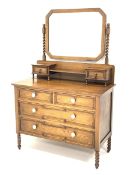 Early 20th century oak dressing chest, canted bevelled edge mirror with barley twist supports, two s