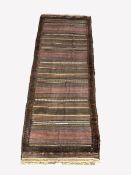 Turkish flat weave red ground rug with multi coloured stripped design and tufted border, 141cmx 37