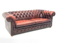 Late 20th century three seat chesterfield sofa upholstered in deeply buttoned red leather, W225cm, D