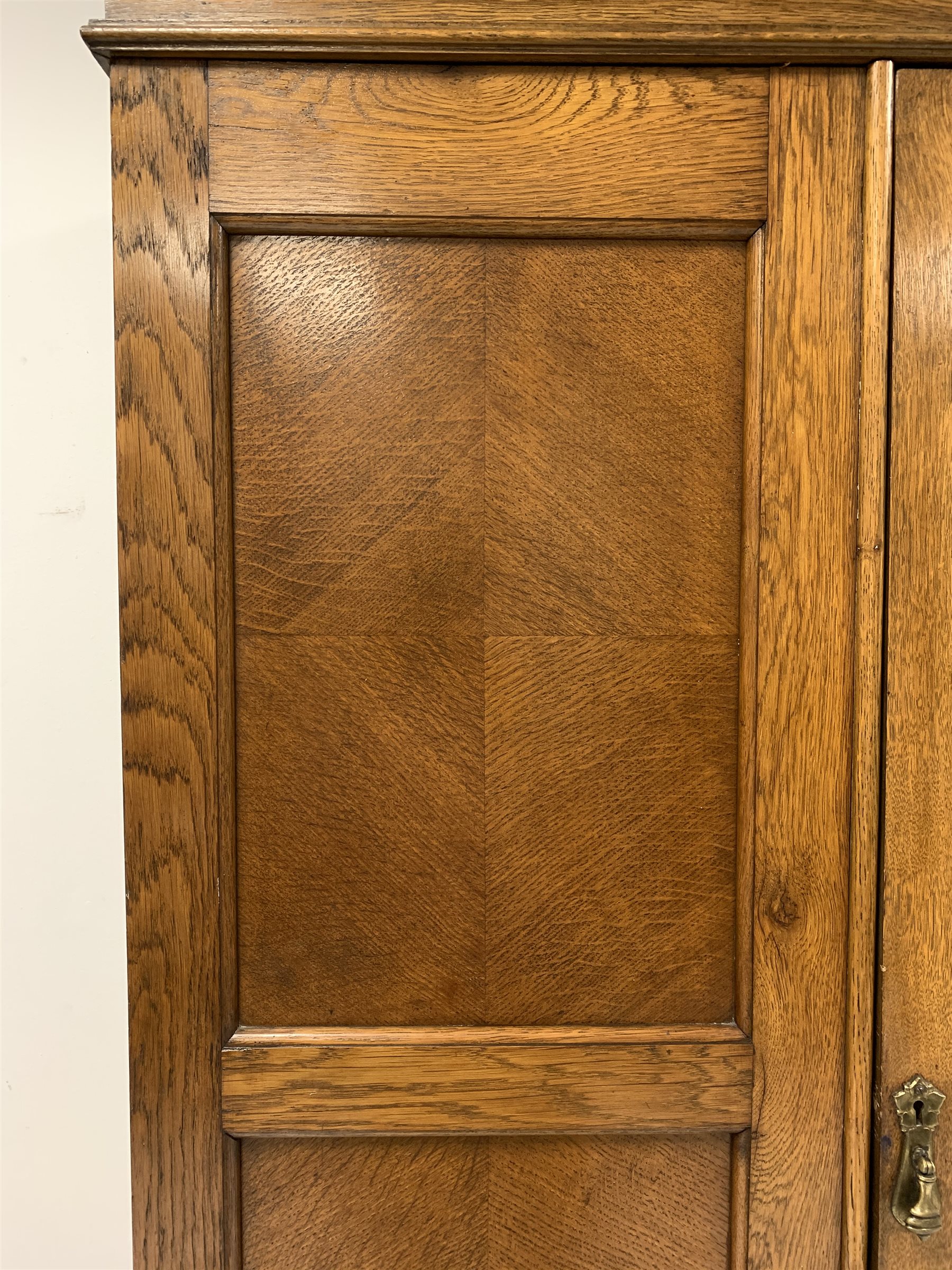 Early 20th century panelled oak wardrobe, projecting cornice over single bevel edged mirror glazed d - Image 3 of 5