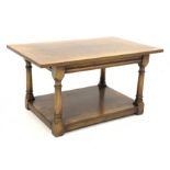 Oak rectangular top coffee table on turned supports joined by undertier, 92cm x 56cm, H48cm