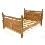 Traditional waxed pine 5' Kingsize bedstead, panelled with turned stretchers and finials, total widt