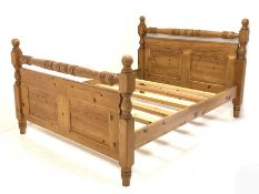 Traditional waxed pine 5' Kingsize bedstead, panelled with turned stretchers and finials, total widt