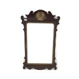 Georgian style upright wall mirror, in scrolled mahogany frame with gilt pierced and carved leaf de