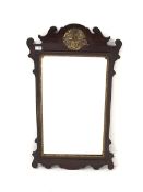Georgian style upright wall mirror, in scrolled mahogany frame with gilt pierced and carved leaf de