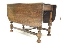 Early 20th century oak drop leaf table, with gadroon moulded edge and leaf carved supports, 148cm x