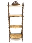 Victorian walnut graduating four tier etagere, each tier serpentine and inlaid with scrolled foliage