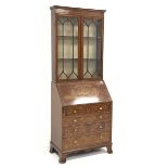 Edwardian mahogany bureau bookcase, the upper section enclosed by a pair of glazed tracery doors, wi